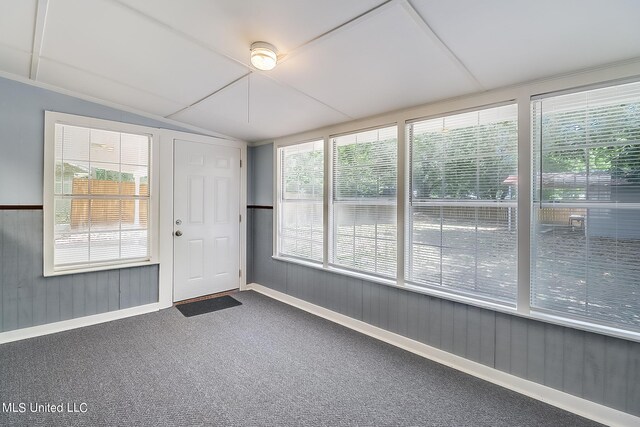 unfurnished sunroom with lofted ceiling and plenty of natural light