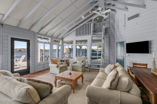 sunroom / solarium with lofted ceiling with beams and ceiling fan