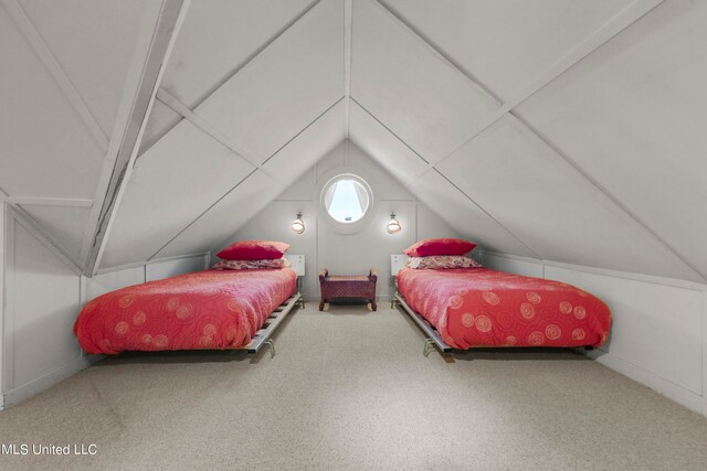 carpeted bedroom featuring lofted ceiling