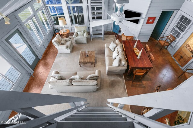 living room with a towering ceiling