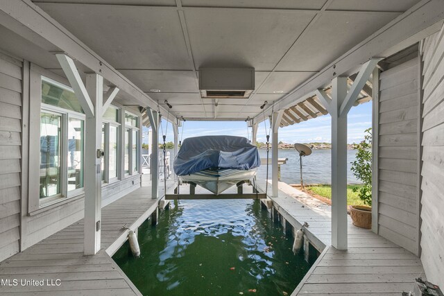 dock area with a water view