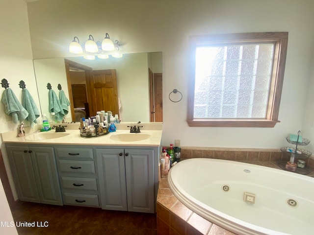 bathroom with vanity, tiled tub, and tile patterned floors