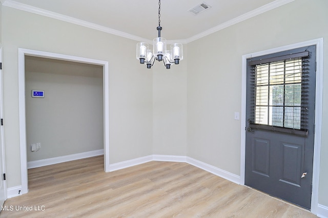 unfurnished dining area featuring ornamental molding, a notable chandelier, and light hardwood / wood-style floors