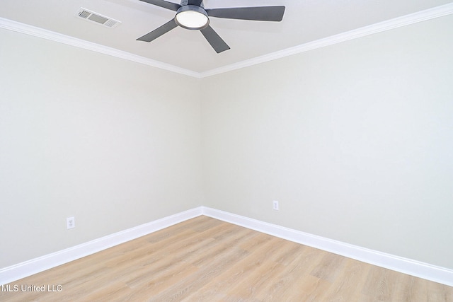 spare room featuring light hardwood / wood-style flooring, ornamental molding, and ceiling fan