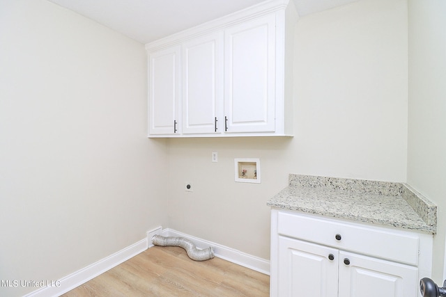 laundry room with cabinets, light hardwood / wood-style flooring, washer hookup, and electric dryer hookup