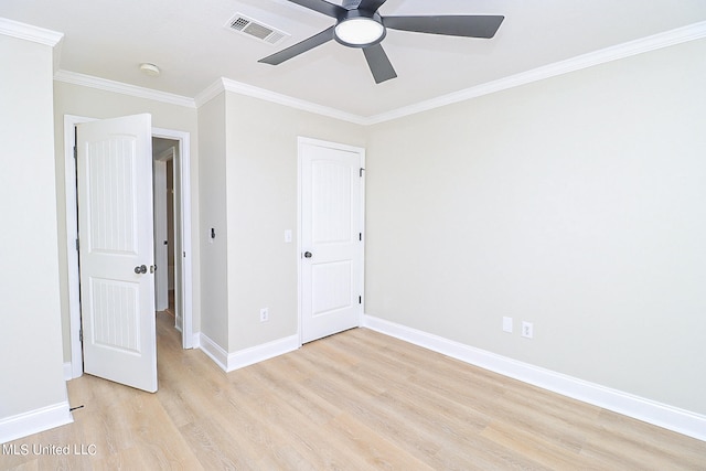 unfurnished bedroom featuring crown molding, light hardwood / wood-style flooring, and ceiling fan