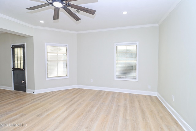 unfurnished room featuring light hardwood / wood-style floors, ornamental molding, and ceiling fan