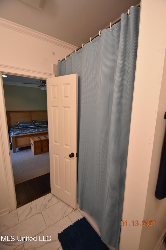 bathroom featuring ceiling fan