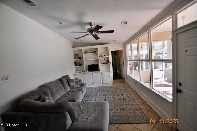 living room featuring crown molding, ceiling fan, and light tile patterned floors