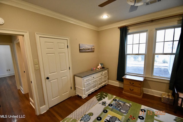 bedroom featuring ceiling fan, crown molding, and dark hardwood / wood-style floors