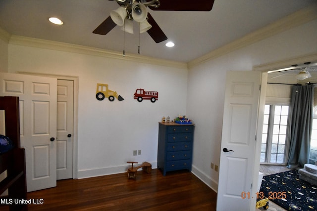 miscellaneous room featuring crown molding and dark wood-type flooring