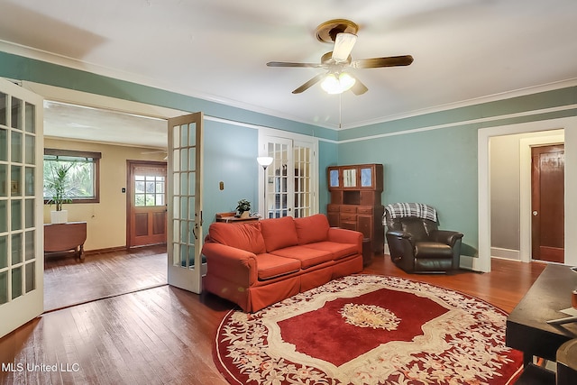 living room featuring a ceiling fan, french doors, crown molding, and hardwood / wood-style floors