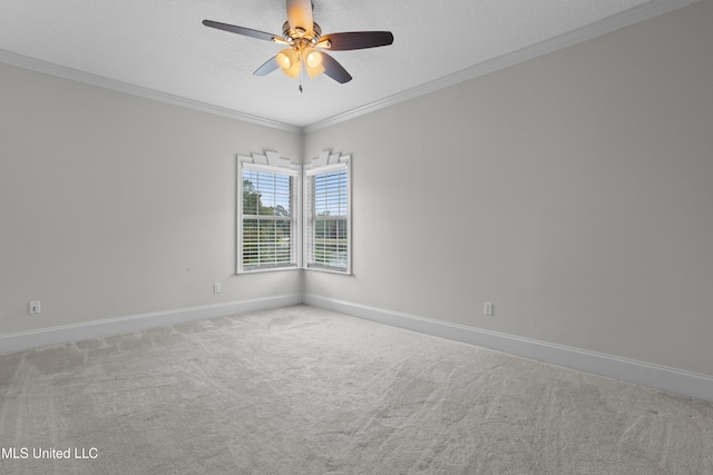 carpeted empty room with a textured ceiling, ceiling fan, and ornamental molding