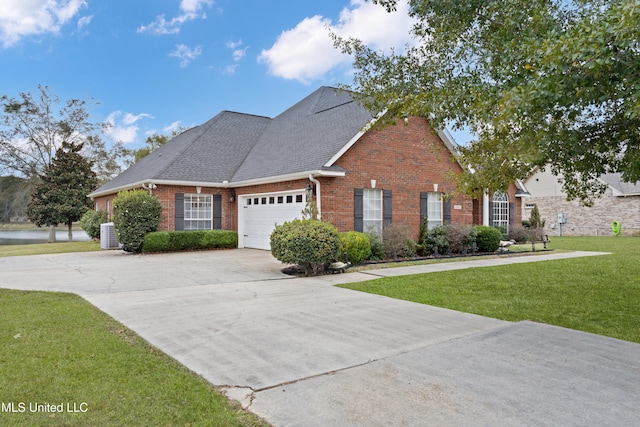 view of front facade featuring central AC unit, a front yard, and a garage