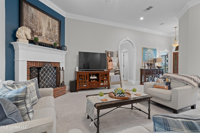 living room with crown molding, light carpet, and a brick fireplace