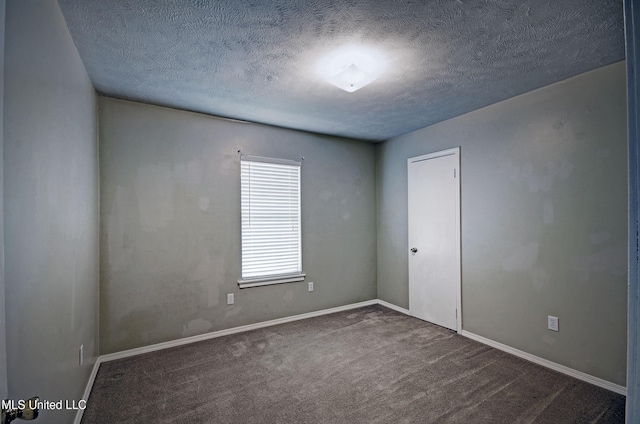 8962 Pleasant Hill Rd, Carthage, MS 39051 - spare room featuring a textured ceiling, carpet, and baseboards