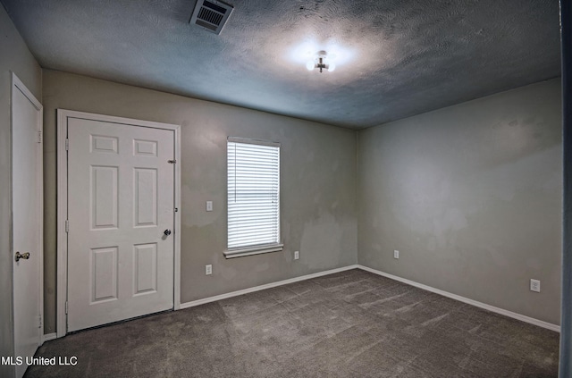8962 Pleasant Hill Rd, Carthage, MS 39051 - unfurnished room featuring carpet floors, a textured ceiling, and baseboards