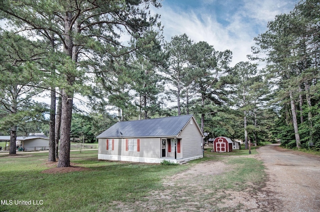 8962 Pleasant Hill Rd, Carthage, MS 39051 - view of front of property with metal roof and driveway
