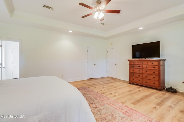 6811 Old Fort Bayou Rd, Ocean Springs, MS 39564 - bedroom with a tray ceiling, ornamental molding, light wood-style floors, recessed lighting, and baseboards