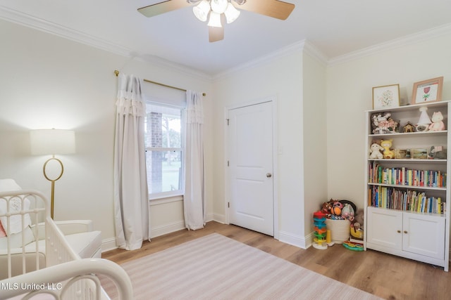 6811 Old Fort Bayou Rd, Ocean Springs, MS 39564 - bedroom with wood finished floors, ornamental molding, baseboards, and ceiling fan
