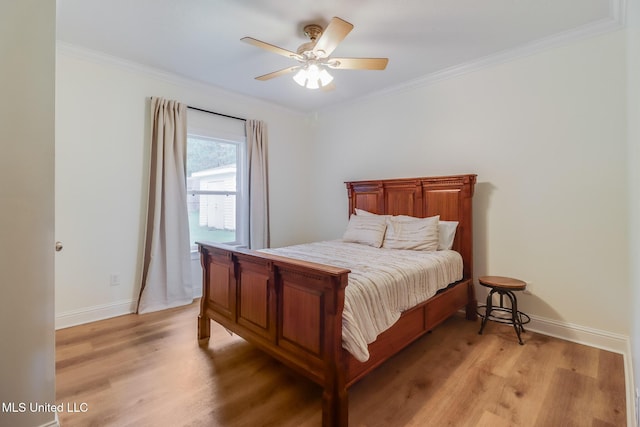 6811 Old Fort Bayou Rd, Ocean Springs, MS 39564 - bedroom with light wood-style flooring, crown molding, baseboards, and a ceiling fan