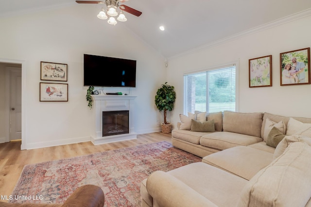6811 Old Fort Bayou Rd, Ocean Springs, MS 39564 - living area featuring crown molding, ceiling fan, light wood-style flooring, vaulted ceiling, and baseboards