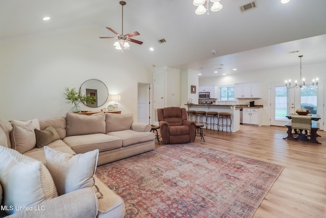 6811 Old Fort Bayou Rd, Ocean Springs, MS 39564 - living room featuring a chandelier, ceiling fan, light wood finished floors, vaulted ceiling, and recessed lighting