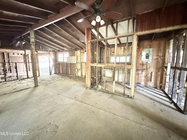misc room with electric panel and ceiling fan