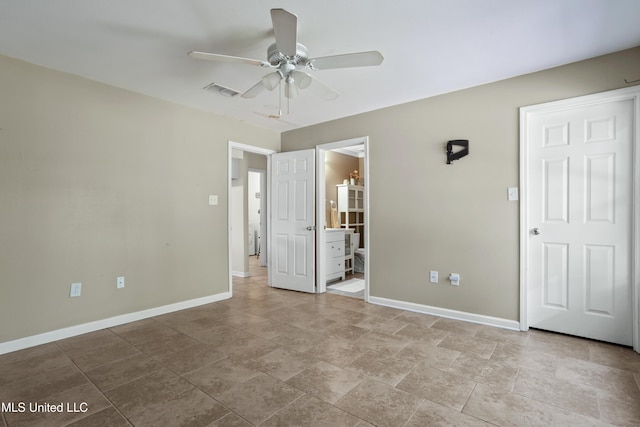 unfurnished bedroom featuring baseboards, ceiling fan, ensuite bath, and visible vents