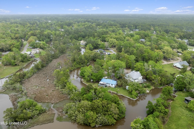 bird's eye view featuring a water view and a wooded view