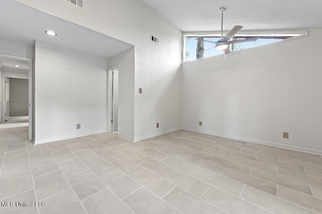 unfurnished room with ceiling fan