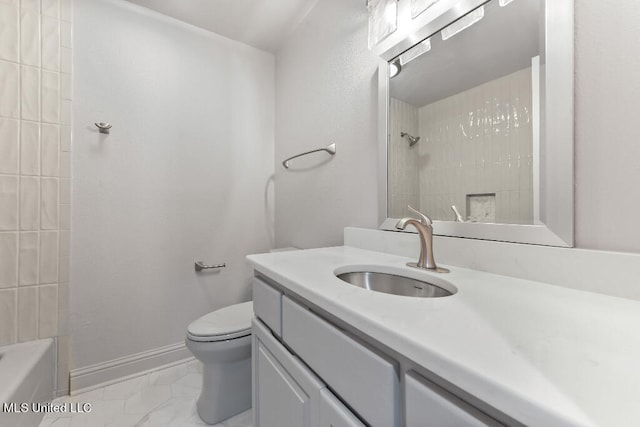 full bathroom with vanity, toilet, and tiled shower / bath