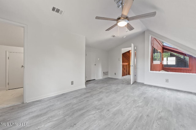 additional living space featuring light hardwood / wood-style floors, lofted ceiling, and ceiling fan