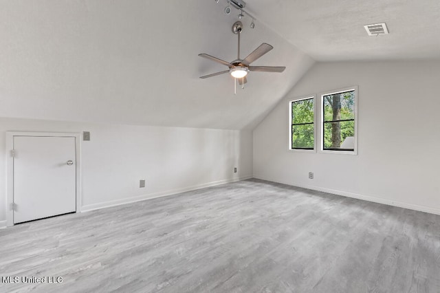 bonus room with light hardwood / wood-style flooring, ceiling fan, and vaulted ceiling