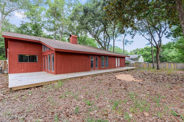 rear view of property with a wooden deck