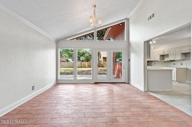 unfurnished living room featuring ornamental molding, a chandelier, and high vaulted ceiling