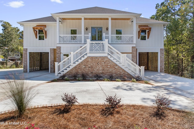 view of front of house with covered porch and a carport