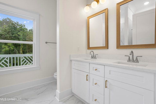 bathroom with vanity and toilet