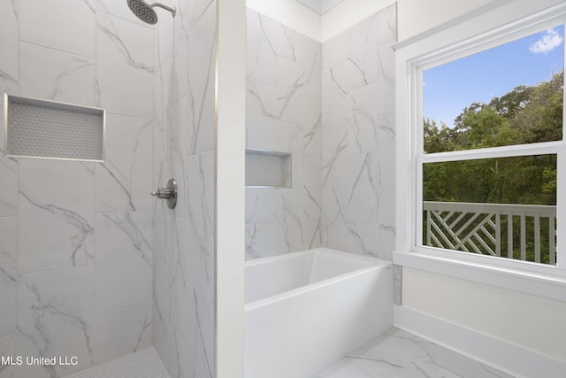bathroom featuring a marble finish shower, marble finish floor, and a tub