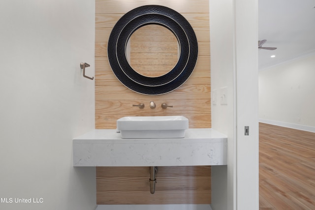 bathroom with vanity, hardwood / wood-style flooring, and ceiling fan