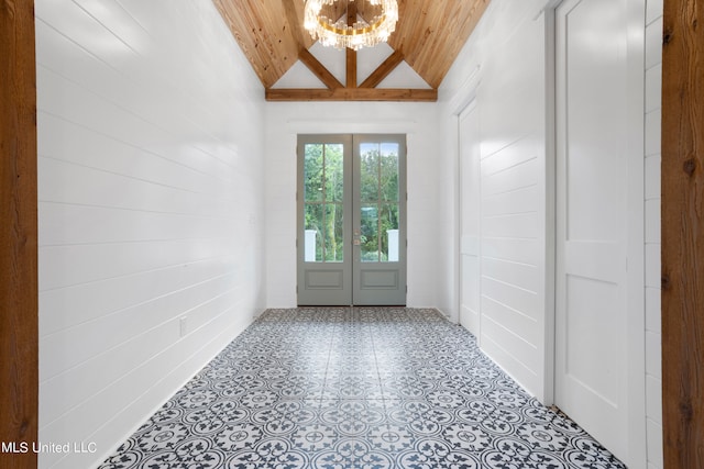 doorway to outside with wood ceiling, a chandelier, and vaulted ceiling