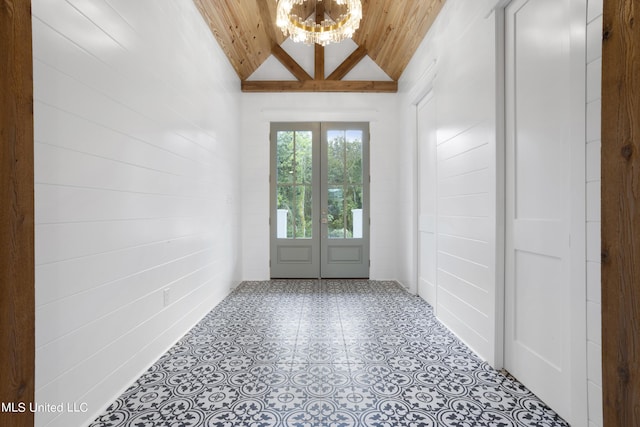 doorway featuring lofted ceiling, a notable chandelier, and wooden ceiling