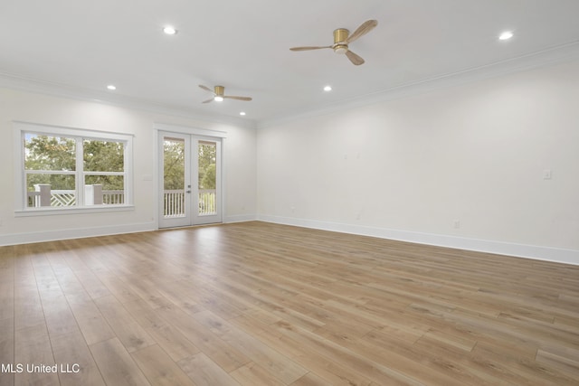spare room featuring french doors, baseboards, ceiling fan, ornamental molding, and recessed lighting