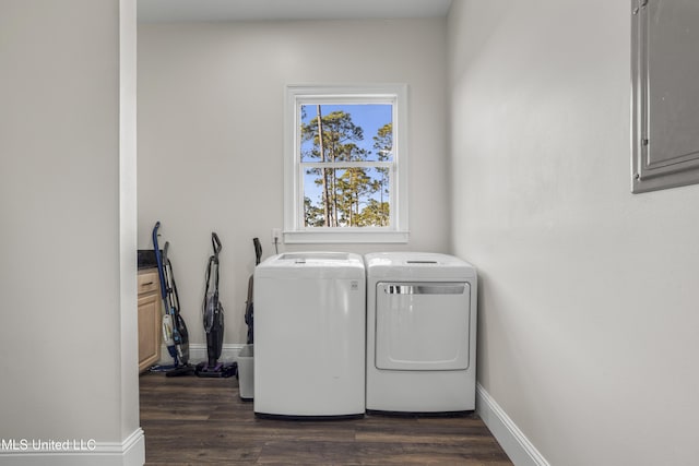 laundry room with washing machine and clothes dryer, laundry area, dark wood finished floors, and baseboards