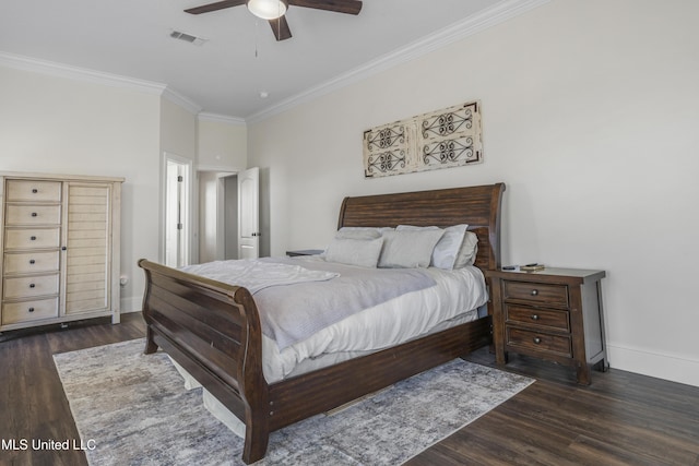 bedroom featuring crown molding, baseboards, visible vents, and wood finished floors