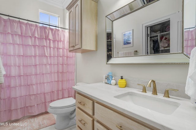full bathroom with vanity, ornamental molding, a shower with shower curtain, and toilet