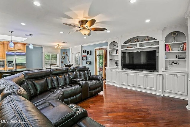 living room with ornamental molding, dark hardwood / wood-style floors, and ceiling fan