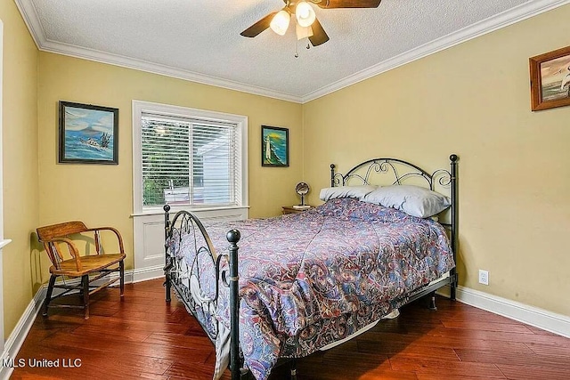 bedroom with hardwood / wood-style floors, crown molding, a textured ceiling, and ceiling fan