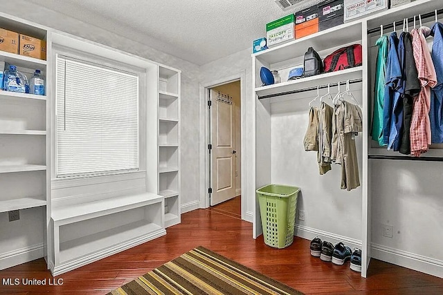 mudroom featuring a textured ceiling and dark hardwood / wood-style flooring