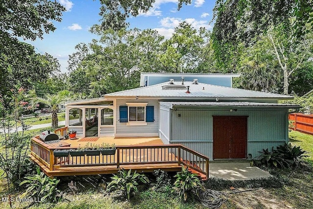 rear view of house with a deck